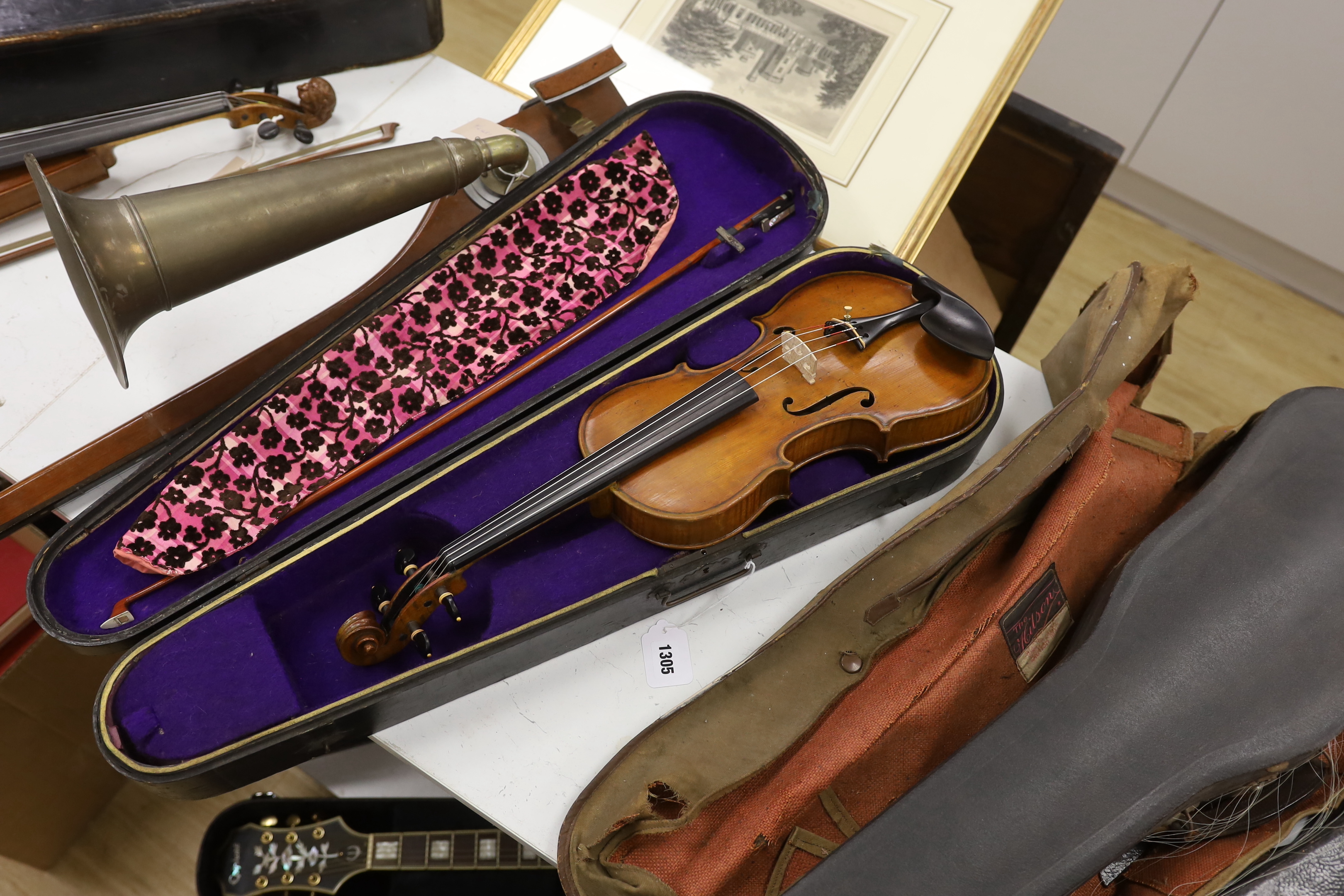 A late nineteenth century English violin by Hidalgo with a label inside the body showing a crown over Hidalgo, with a bow in an ebonised wooden case, body 36cm